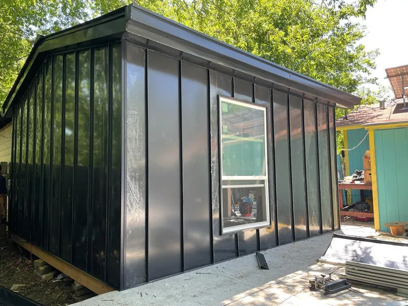 Black standing seam metal wall panels for Roof Inspection in San Antonio